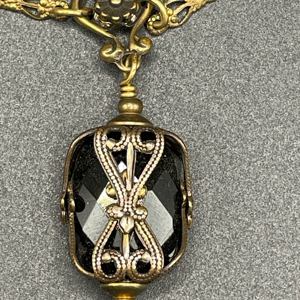 Elegant Black And Gold Pendant Necklace